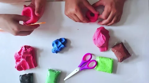 Child hands playing with colorful clay. Stock Footage 280185553
