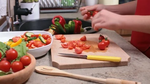 Child hands preparing tomatoes for salad - side view Stock Footage 80114875