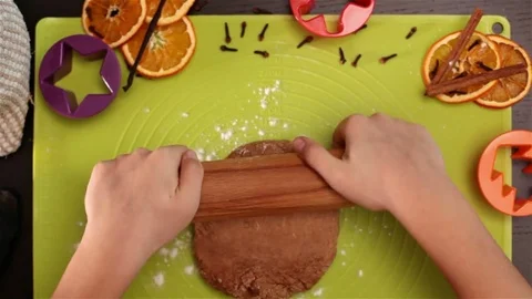 Child hands stretching the christmas cookie dough Stock Footage 80299209