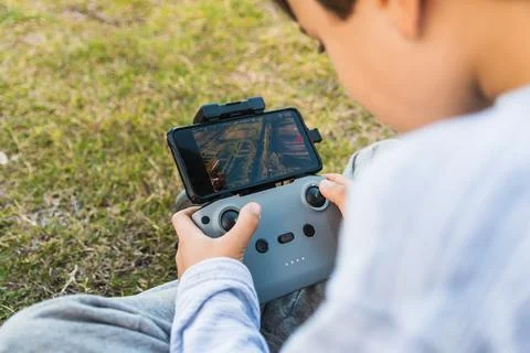 Child hands using drone control Stock Photos