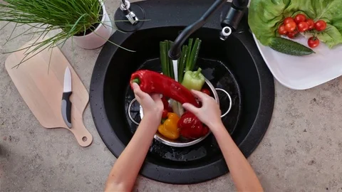 Child hands washing vegetables to make a salad Stock Footage 77716082