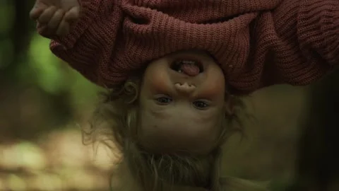 Child hanging upside down on the playground Stock Footage 154563788