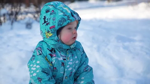 The child is happy with the snow Stock Footage 149756935