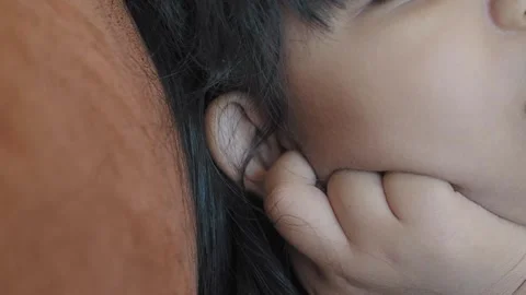 Child having ear pain touching his painful ear , Stock Footage 285296900