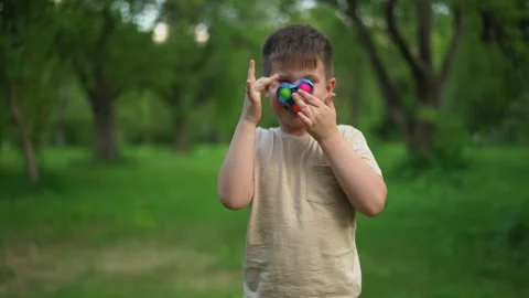 Child is Having Fun and Playing an Anti-Atress Toy. Stock Footage 159000372
