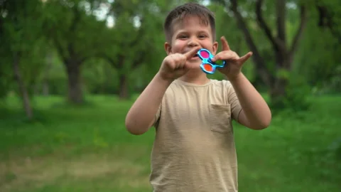 Child is Having Fun and Playing an Anti-Atress Toy. Stock Footage 161954556