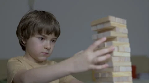 Child Having Fun Building Constructor Tower of Wooden Blocks. Boy Playing W.. Vídeos de archivo 328751159