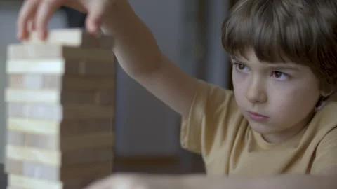 Child Having Fun Building Constructor Tower of Wooden Blocks. Boy Playing W.. Video stock 328752148