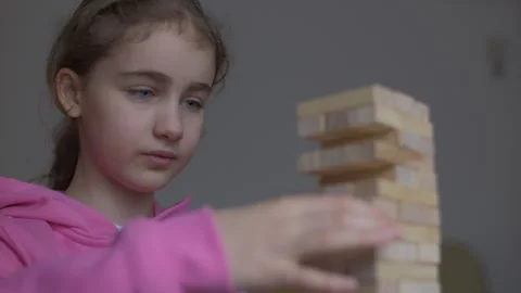 Child Having Fun Building Constructor Tower of Wooden Blocks. Girl Playing .. Stock Footage 328754017