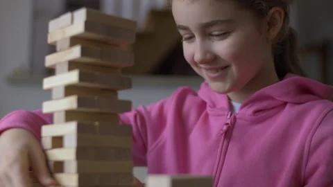 Child Having Fun Building Constructor Tower of Wooden Blocks. Girl Playing .. Stock Footage 328771794