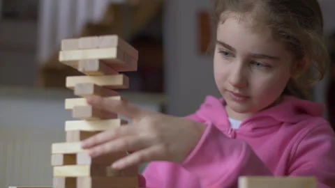 Child Having Fun Building Constructor Tower of Wooden Blocks. Girl Playing .. Stock Footage 328873727