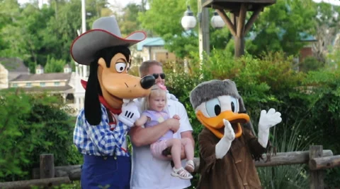 Child having fun with family at the international most famous Disney park Stock Footage