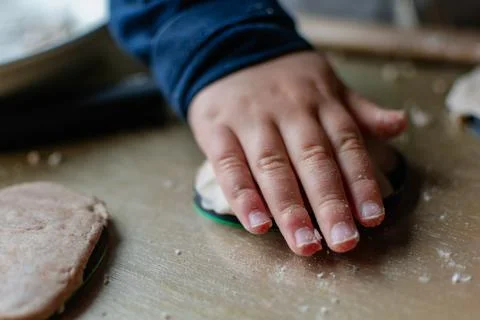 Child having fun modeling salt dough, authentic activity, fine motor skills.. Stockfoto's