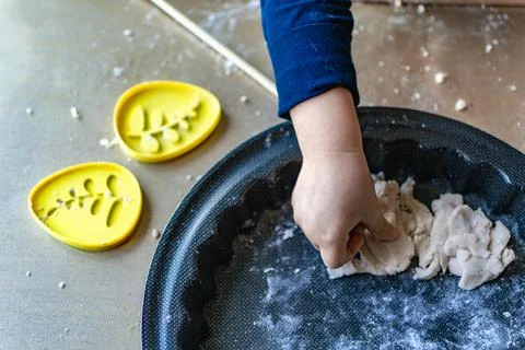 Child having fun modeling salt dough, authentic activity, fine motor skills.. 스톡 사진