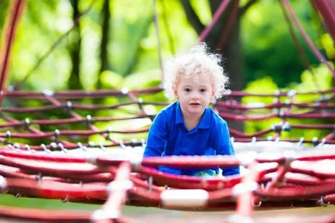 Child having fun on school yard playground Stock Photos