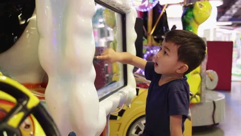 Child having fun on a slot machine. Stock Footage 168524873
