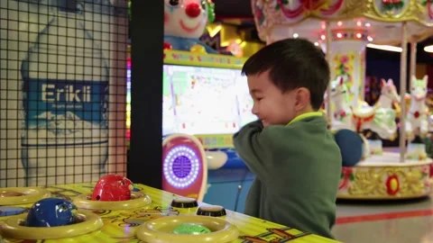 Child having fun on a slot machine. Antalya-Turkey. 01.09.2022 Stock Footage 168970188