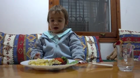 Child having meal at the table Stock Footage 60676120