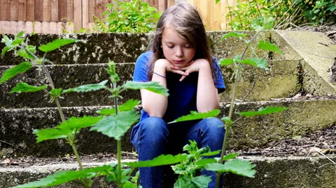 Child with head in hands Stock Footage 39076169