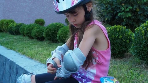A child in a helmet on rollers. Stock Footage 77966945