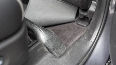 Child Helping Vacuum Car Interior Floor Under Mat Close Up 4K Stock Footage 336450791