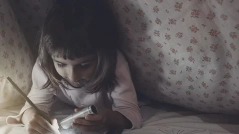 Child is hiding under a blanket. Stock Footage 98175095