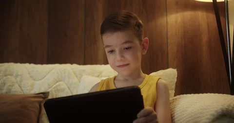 Child hold pad computer surfing not safe content online internet at home concept Stock Footage 255735152