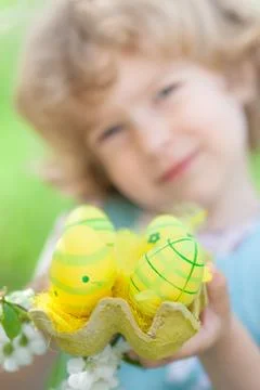 Child holding easter eggs 스톡 사진