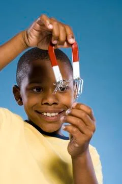 Child holding a magnet. Foto stock