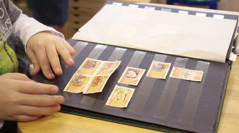 Child holding a postage stamp Stock Footage 36041898