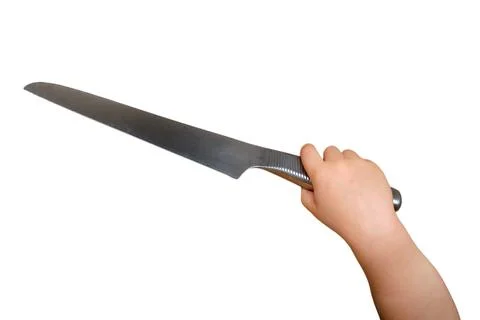 Child holding sharp metallic kitchen knife. Dangerous situation involving kid Stock Photos