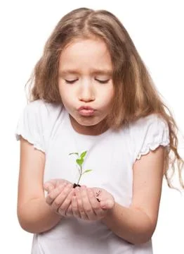 Child holding a sleedling Stock Photos
