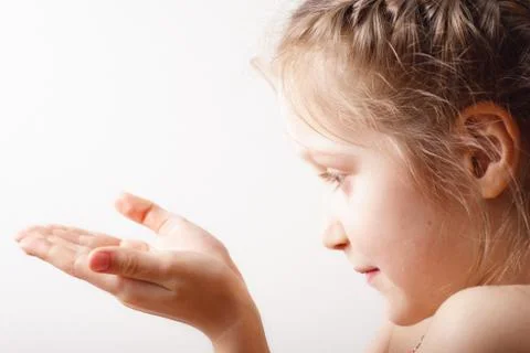 Child holding something shining Stock Photos