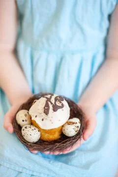 Child holds an Easter cake Stock Photos