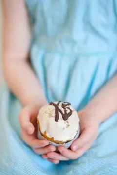 Child holds an Easter cake Stock Photos