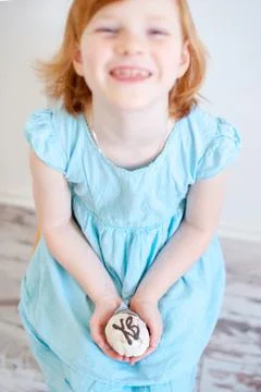 Child holds an Easter cake Stock Photos