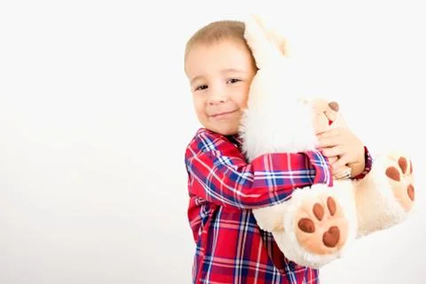 Child hugging toy Stock Photos