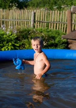 The child in inflatable pool. Stock Photos