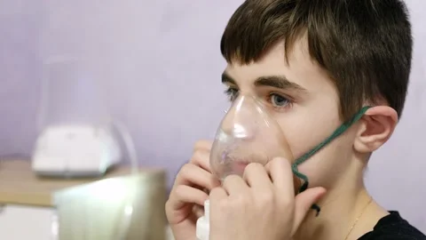 Child inhale using a nebulizer. Stock Footage 145688767