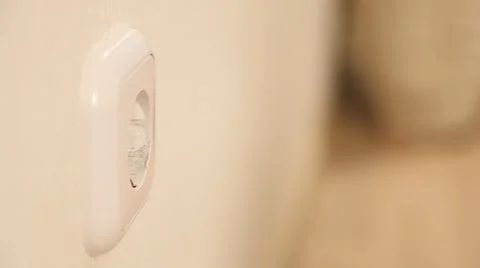 Child inserting a plug into a socket Stock Footage 61268976