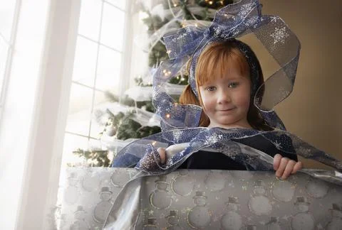 Child Inside Christmas Present Stock Photos