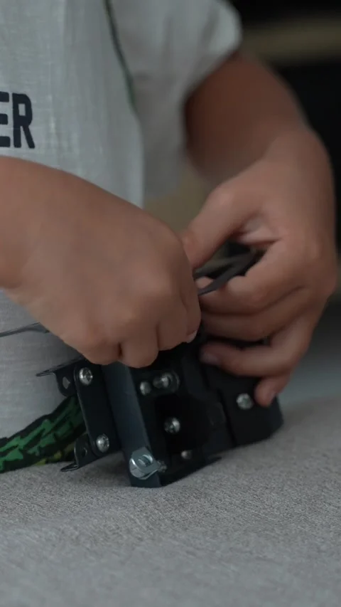 Child Installing Black Metal Mounting Bracket with Hands 스톡 동영상 346847378