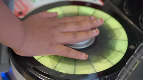 Child interacts with colorful touch screen pad during play Stock-Footage 338041791