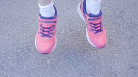 Child Jumping On The Asphalt Stock-Footage 139132280