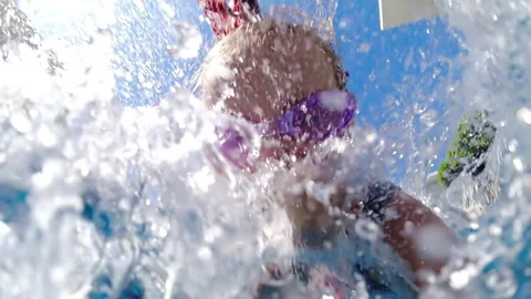 Child jumping somersault in the pool Stock Footage 264087366