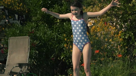 Child jumping into swimming pool - slow motion Stock Footage 40101469