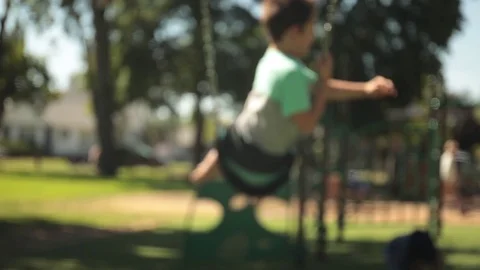 Child jumping off swing 動画素材 113956628