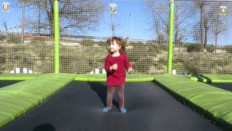 Child jumping on trampoline Stock Footage 71407246