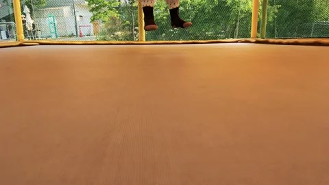 A child jumping on a trampoline Video stock 194494124