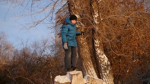 A child jumps into the snow 库存影片 69878582